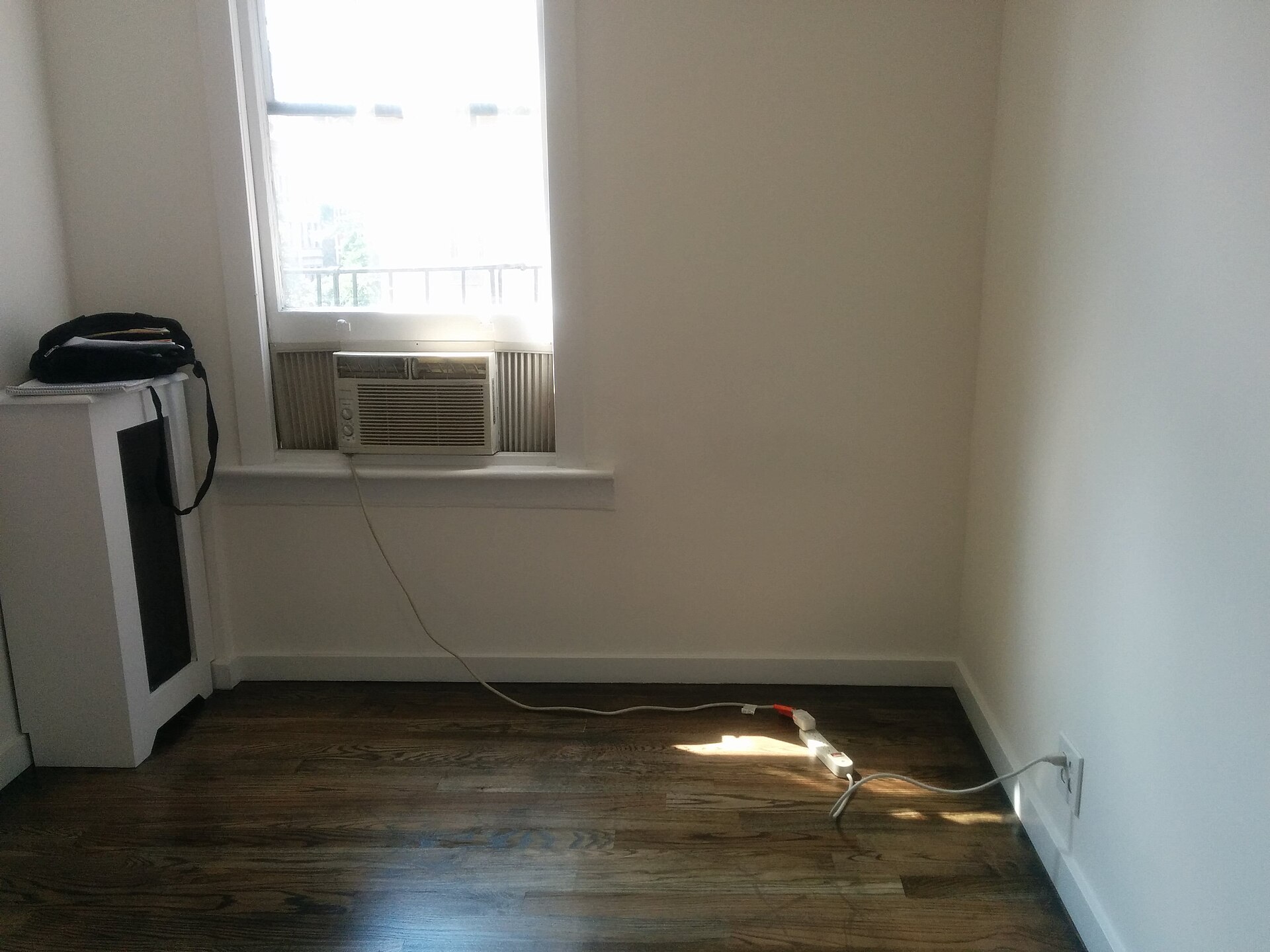 An empty room ready for new flooring, with clear light and a plain floor
