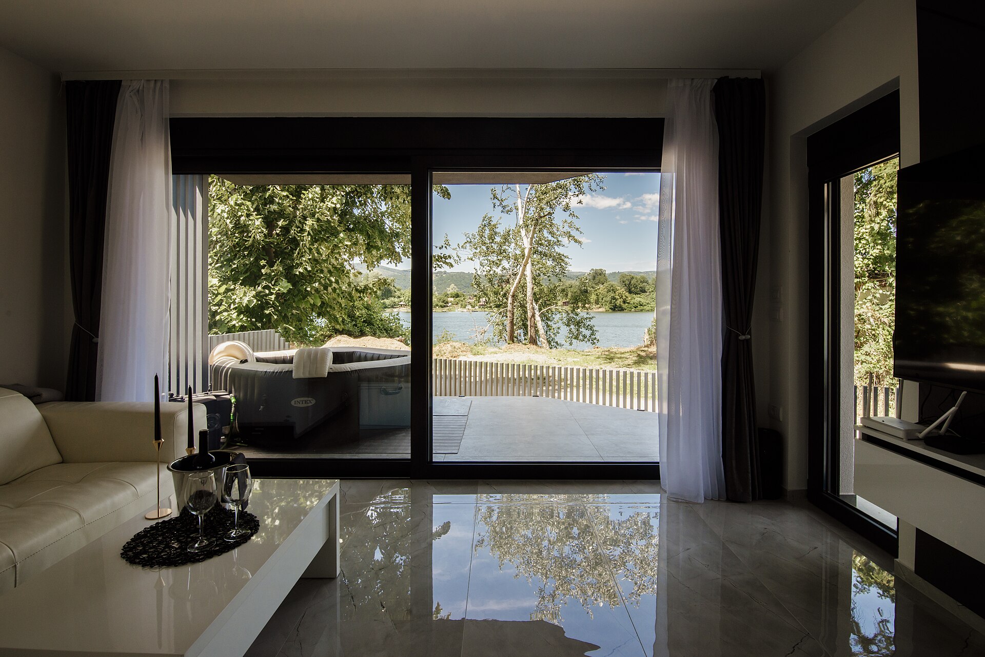 A bright modern living room with large windows, for contrast with the north-facing case