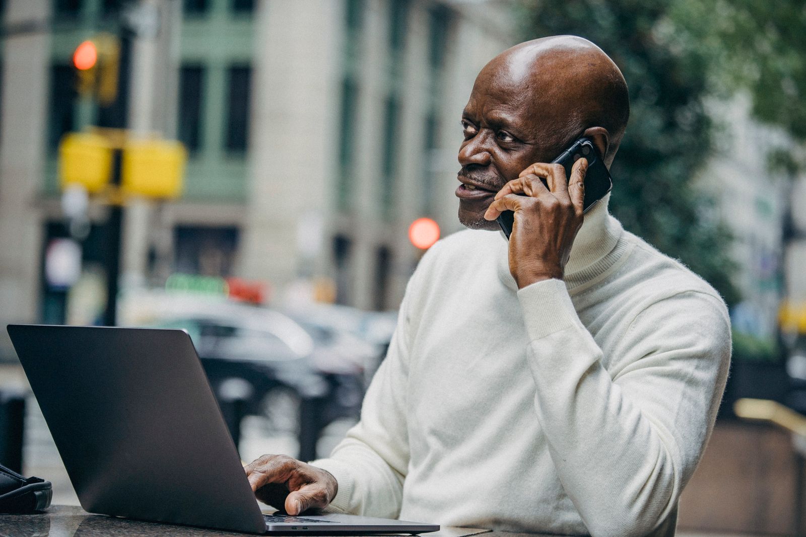 A business owner taking a customer call on a mobile phone