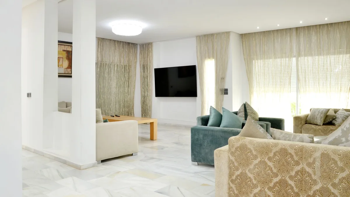 A cohesive, professionally styled modern living room that looks like part of a polished listing set