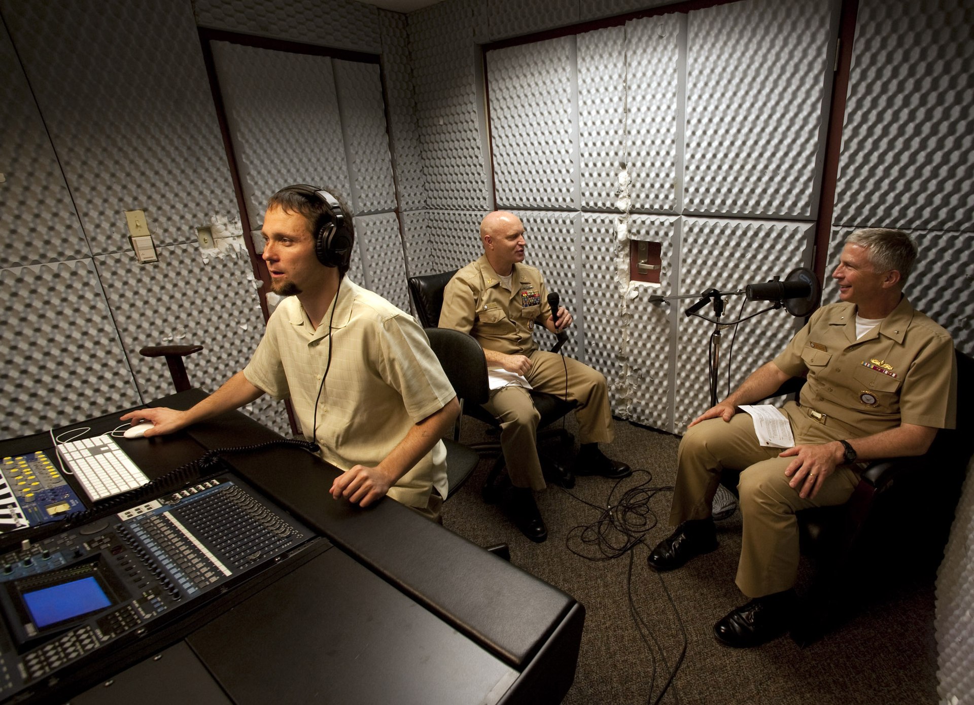 People adjusting recording levels before starting a session