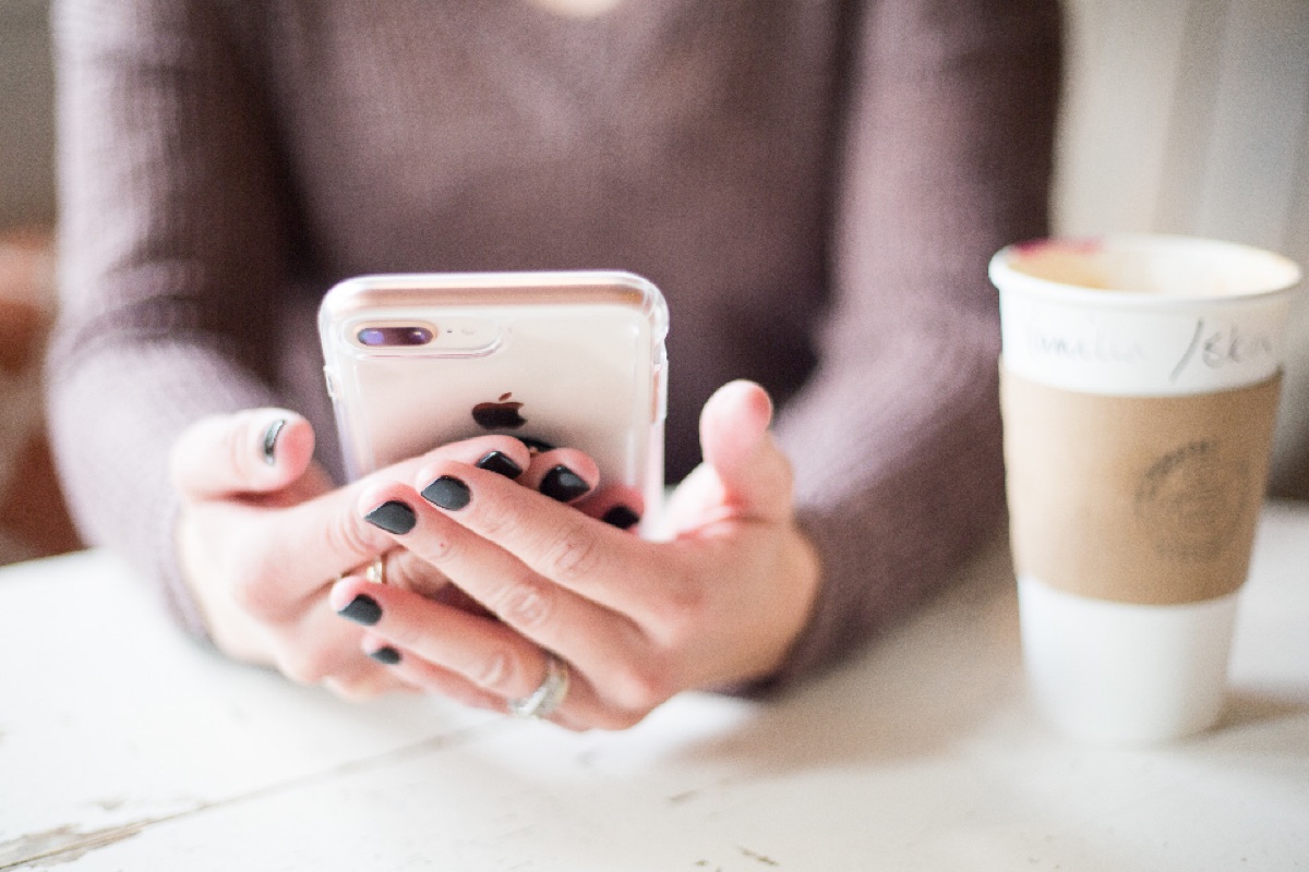 A hand holding a ringing smartphone
